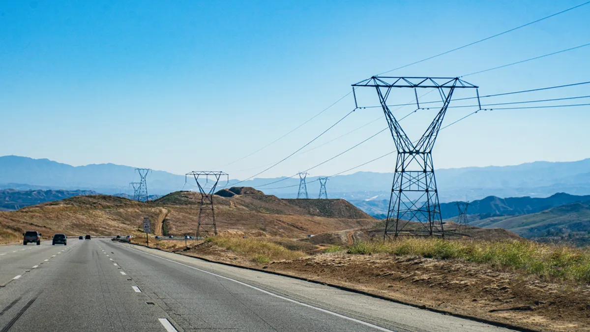 Transmission lines next to a highway in California.